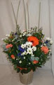 Flower arrangements with carnations,daisies and roses at Twiggs Florist JHB logo